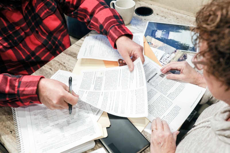 couple looking over rv manual